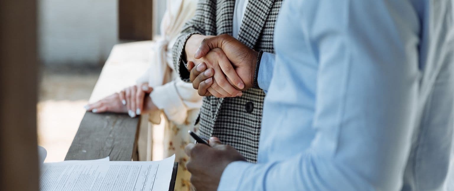 Close up image of two people shaking hands